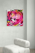 Care Bears neon artwork displayed above a white sofa