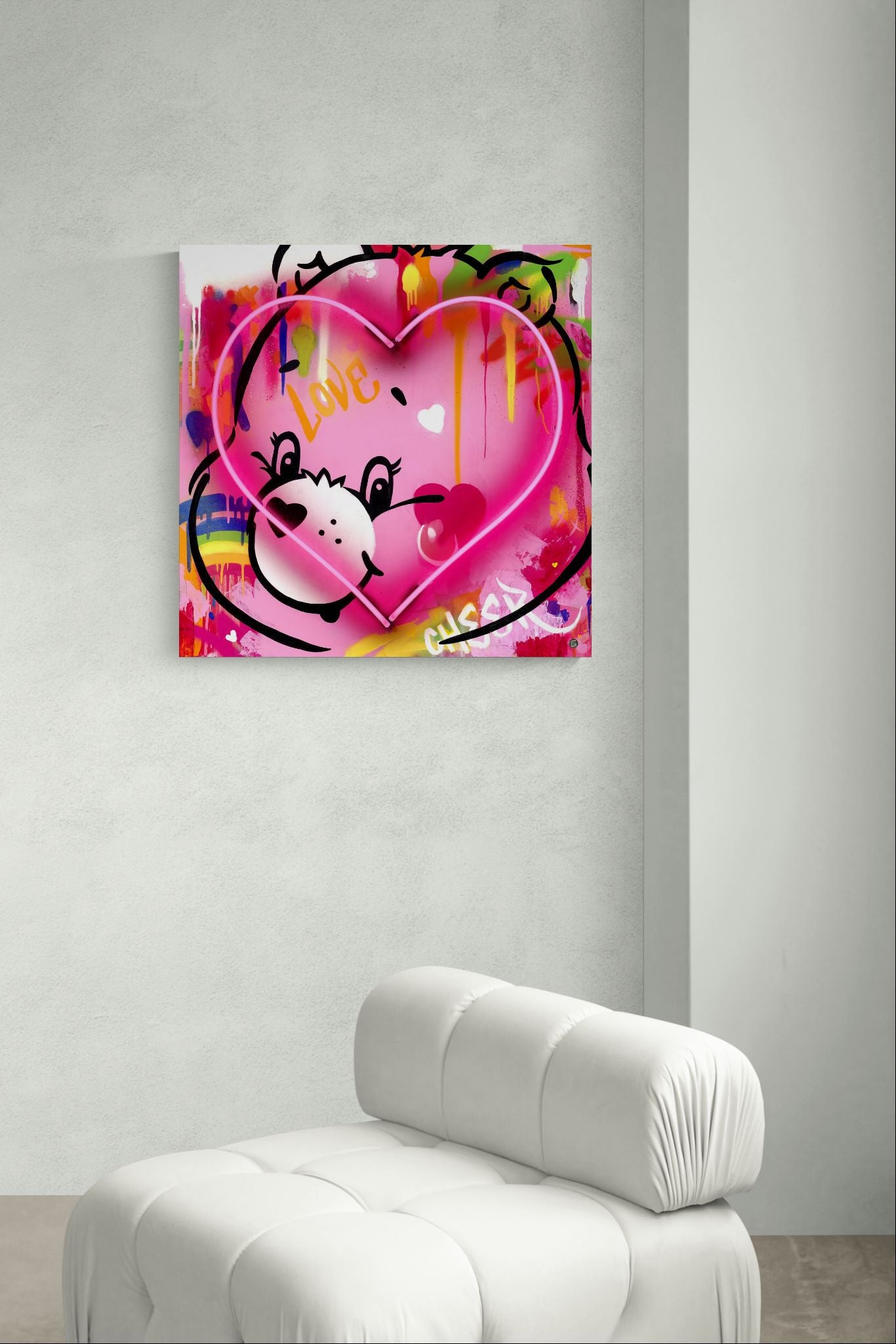 Care Bears neon artwork displayed above a white sofa