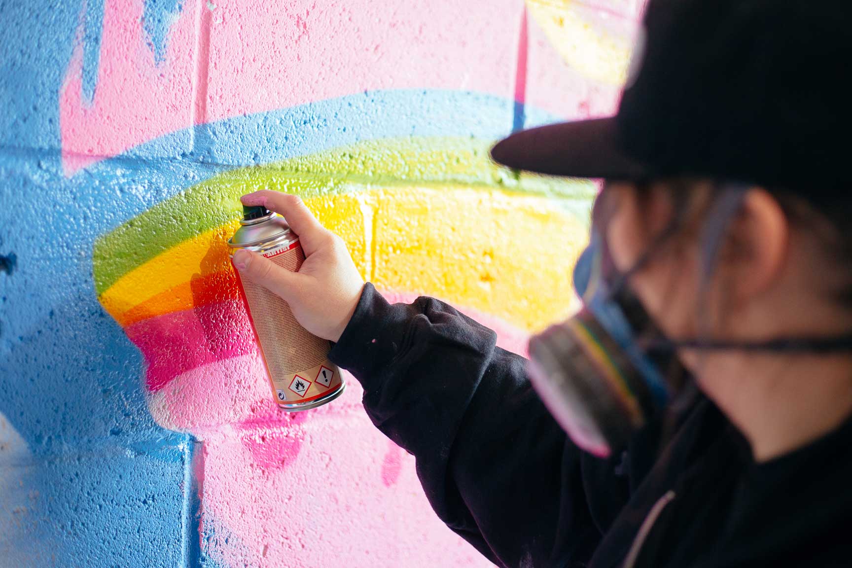 Painting Cheer Bear's rainbow