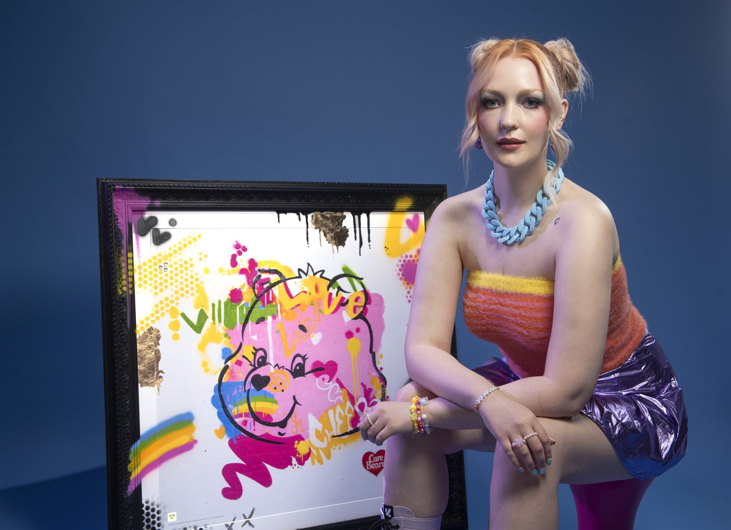 Care Bears collector print beside a campaign model